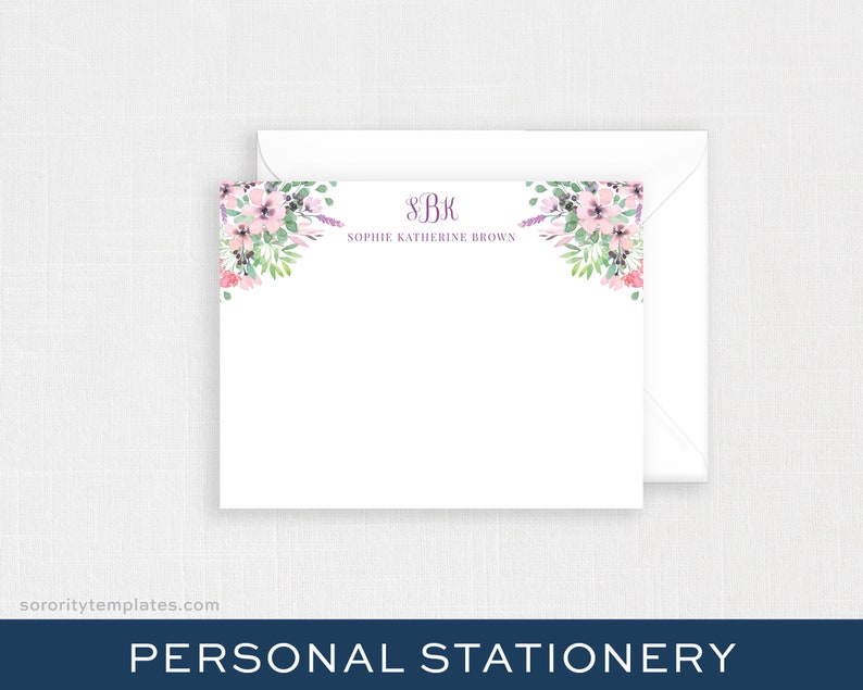 May include: A white card with a floral border and the text "SBK Sophie Katherine Brown" in purple lettering. The card is for personal stationery.