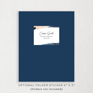 May include: A navy blue folder with a white sticker. The sticker has the name "Carson Smith", school name, and city. The sticker is 4 inches by 3 inches. The text "OPTIONAL FOLDER STICKER 4" X 3" (folders not included)" is at the bottom.