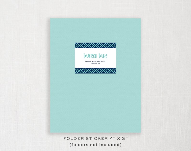 May include: A light blue folder sticker with a dark blue geometric border and the text "Lauren Lane" and "Edmond North High School, Edmond, OK". The sticker is 4 inches by 3 inches.