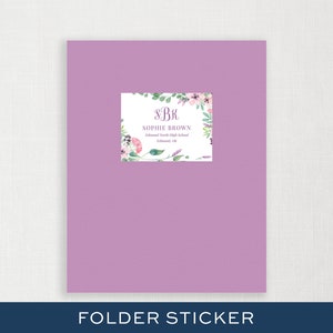 May include: A purple folder with a floral sticker that says "S.B.K. Sophie Brown Edmond North High School Edmond, OK"