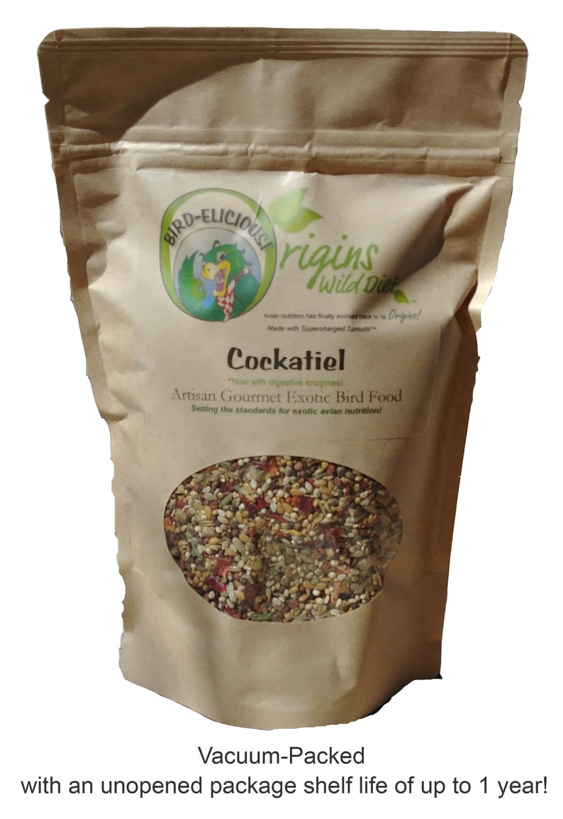 May include: A brown paper bag with a clear window showing a mix of bird seed. The bag has a logo with a cartoon bird and the text "Bird-Elicious Origins Wild Diet". The text "Cockatiel Artisan Gourmet Exotic Bird Food" is printed on the bag. The text "Now with digestive enzymes!" is printed on the bag. The text "Setting the standards for exotic avian nutrition!" is printed on the bag. The text "Vacuum-Packed with an unopened package shelf life of up to 1 year!" is printed below the bag.