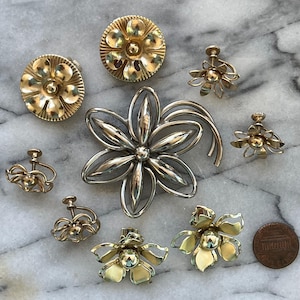 1960s Flower Power Costume Jewelry Lot: 1 Silver Brooch, 4 Gold Tone Non-pierced Clip-on Earrings