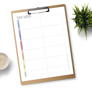 May include: A weekly planner on a clipboard with a brown wooden frame. The planner has a column for each day of the week: Monday, Tuesday, Wednesday, Thursday, Friday, and a notes column. The days of the week are labeled with colored stripes.