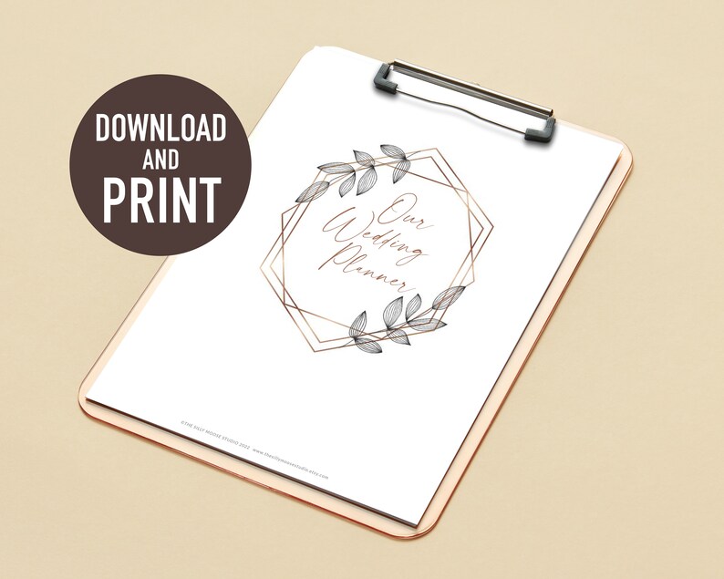 May include: A printable wedding planner with a gold geometric frame and floral accents. The text "Our Wedding Planner" is written in cursive inside the frame.