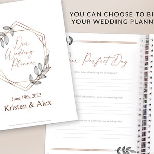 May include: A wedding planner with a gold geometric frame and floral design. The cover says "Our Wedding Planner" and includes the date "June 19th, 2023" and the names "Kristen & Alex". The inside pages have a section titled "Our Perfect Day" with questions about the wedding.
