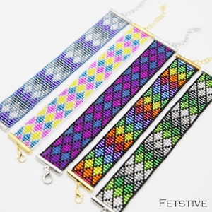 May include: Six colorful beaded bracelets with different geometric patterns, including hearts, diamonds, and stripes. The bracelets are made with small beads and have silver clasps. The word "FESTIVE" is printed in white on a black background at the bottom of the image.