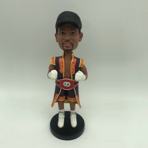 Custom bobblehead for a professional boxer with professional belt