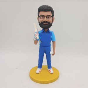 custom sports bobblehead for cricket fan,cricket bat on one shoulder and small cricket ball in the other hand,birthdays gifts for him