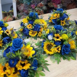 Sunflower navy blue table decor, Yellow blue arch flowers, Rustic wedding decor