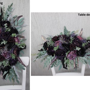 May include: An 18-inch long floral swag and table decor. The arrangement features black and purple roses, berries, and greenery. Accents include silver and gold-toned elements, creating a dramatic and elegant aesthetic. The swag is displayed on a white chair.