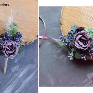 May include: A boutonniere and a corsage featuring artificial flowers. The boutonniere has a purple rose, sprigs, and berries, with a twine-wrapped stem. The corsage includes a purple rose, berries, and greenery, with a pink ribbon.