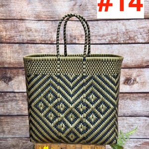 May include: Woven tote bag with a geometric pattern in black and olive green. The bag has two handles and is displayed on a wooden stand. The number "#14" is displayed in red. The brand "RAMPOS MX" is displayed in the top left corner.