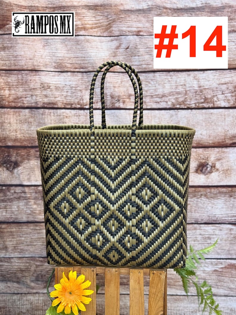 May include: Woven tote bag with a geometric pattern in black and olive green. The bag has two handles and is displayed on a wooden stand. The number "#14" is displayed in red. The brand "RAMPOS MX" is displayed in the top left corner.
