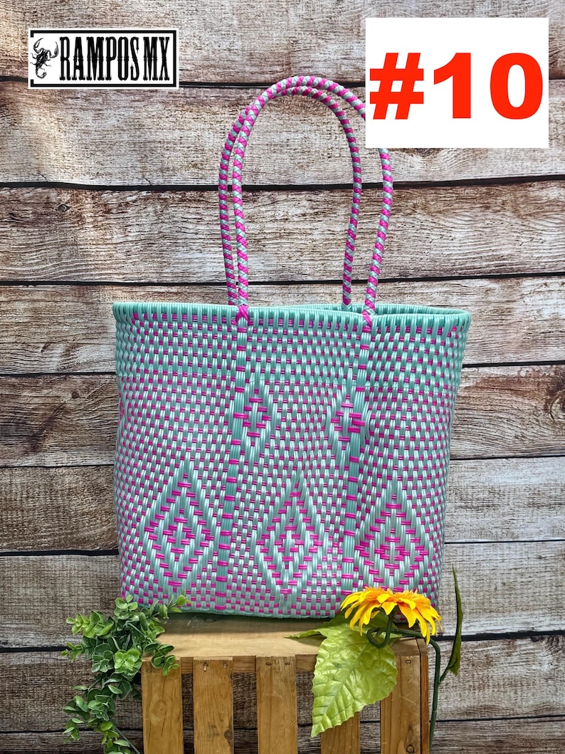 May include: A woven tote bag featuring a mint green and hot pink geometric diamond pattern with two matching braided handles. The bag displays the text RAMPOS MX and the number #10 in the upper corners of the image.