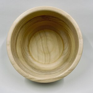 Small turned pine bowl with criss-crossing grain.