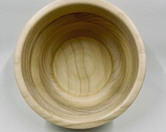 Small turned pine bowl with criss-crossing grain.