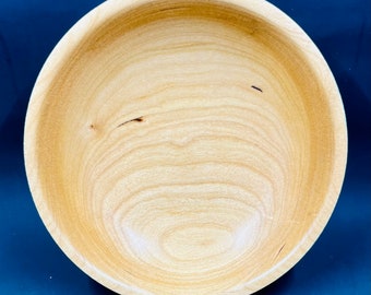 Figured maple bowl turned on lathe and blue and green color added to outside