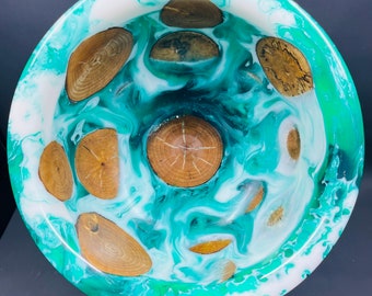 Handmade bowl containing pieces birch limbs encased in green and white resin, just in time for the holidays.