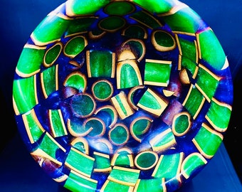 Purple resin bowl with bamboo filled with green resin