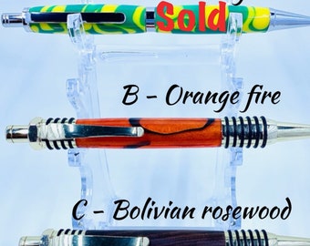 Handmade acrylic and wood turned pens – Yellow and green acrylic gel writer, Orange fire spartan pen, and Bolivian rosewood spartan pen