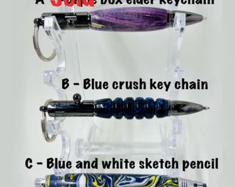 Handmade bolt action key chain in either purple box elder or blue crush or a sketch pencil in blue and white acrylic.