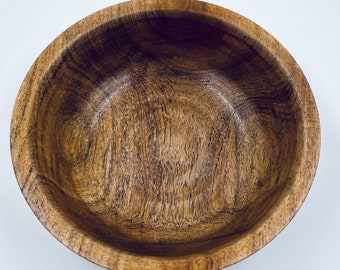 Wooden bowl with cool coloring and grain.