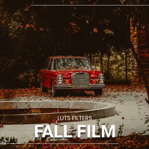 May include: A red vintage car parked in a driveway with fallen autumn leaves. The car has a chrome bumper and a black grille. The text "LUTS FILTERS FALL FILM" is displayed below the car.