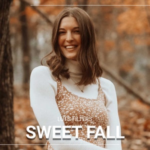 May include: A woman with long brown hair smiles in a white turtleneck sweater with a brown and white floral print sleeveless top underneath. The background is a blurred image of fall foliage. The text "LUTS FILTERS SWEET FALL" is at the bottom of the image.