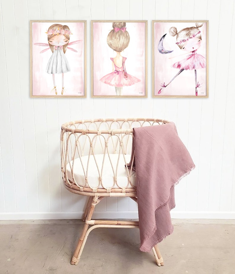 May include: Three framed watercolor illustrations of ballerinas with pink tutus and floral crowns. The illustrations are set against a light pink background.