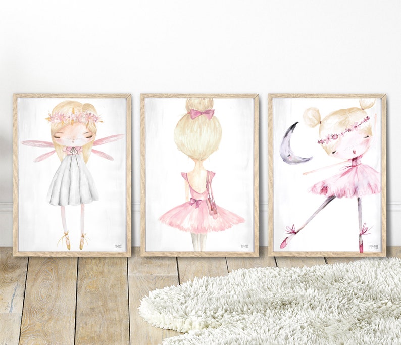 May include: Three framed watercolor illustrations of ballerinas. The first ballerina is wearing a white dress and has wings. The second ballerina is wearing a pink dress and has her hair in a bun. The third ballerina is wearing a pink dress and is dancing with a crescent moon.