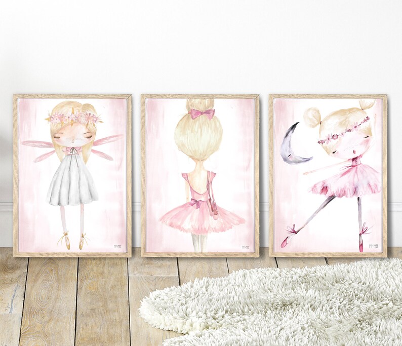 May include: Three framed watercolor illustrations of ballerinas. The first ballerina is wearing a white dress and has wings. The second ballerina is wearing a pink tutu and has her hair in a bun. The third ballerina is wearing a pink tutu and is dancing with a crescent moon.
