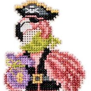 May include: A beaded flamingo ornament dressed as a pirate, wearing a black hat with a white skull and crossbones, a black eye patch, and a green neckerchief. The flamingo holds a purple sack with a gold dollar sign and has one red leg.