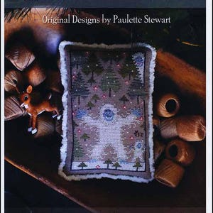 May include: A cross-stitch pattern bundle titled "Abominable Bundle" by Plum Street Samplers. The design features a winter scene with trees and a snowman. The image includes spools of thread and a small reindeer figurine.