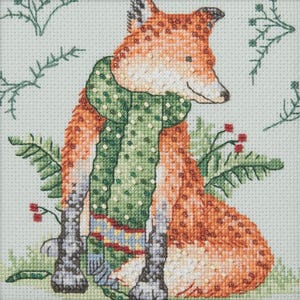 May include: Cross-stitch of a fox wearing a green scarf with white dots. The fox has orange and white fur and is surrounded by green foliage and red berries. The background is a light green color.