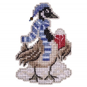 May include: A beaded cross-stitch ornament of a cartoon goose wearing a blue and white scarf and a blue hat, holding a red and white cup. The goose is standing on a white background.