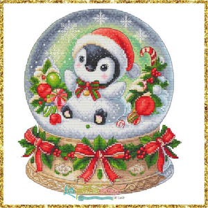 May include: Cross-stitch design of a penguin in a snow globe wearing a Santa hat. The penguin is surrounded by Christmas decorations, including a candy cane, ornaments, and a bow. The base of the snow globe has red bows and holly.