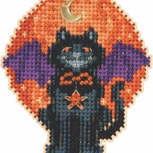 May include: A black cat with a purple bat wing on each side, a gold star on its chest, and a gold bow tie. The cat is standing on a background of orange and yellow with a crescent moon in the upper right corner.