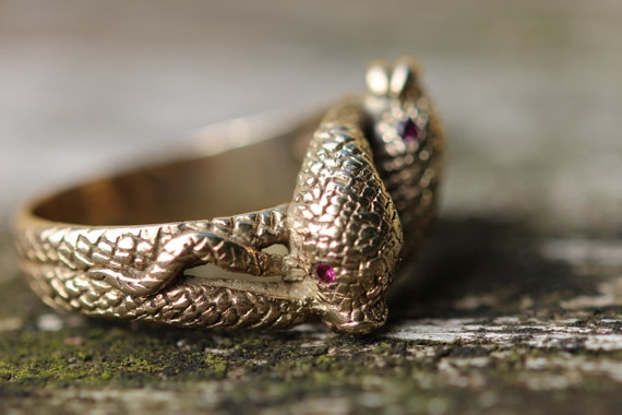 Gold snake ring with ruby eyes meaning deals