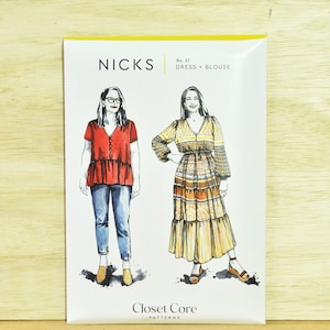 May include: A sewing pattern for a dress and blouse called "Nicks" by Closet Core Patterns. The pattern shows two illustrations of women wearing the garment. The woman on the left is wearing a red blouse with a white button and blue jeans. The woman on the right is wearing a long yellow, brown, and white striped dress.