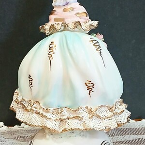 Lady in Flower Hat and Pink Frilled Dress with Gold Trim 7