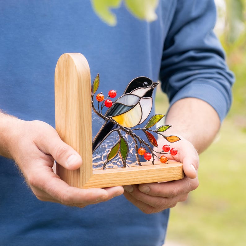 stained glass bird ornament as bookend decor.