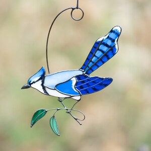 Stained Glass Blue Jay window hangings decorated with green stained glass leaves and copper decoration