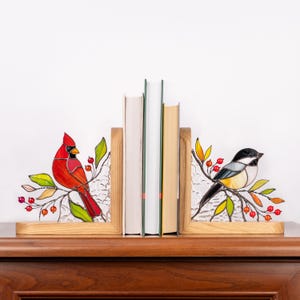 Bookend with stained glass bird and orange-red bead accents.