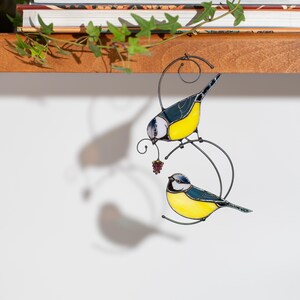handmade chickadees window hanging with vivid yellow and blue colors, artistic bird decor.