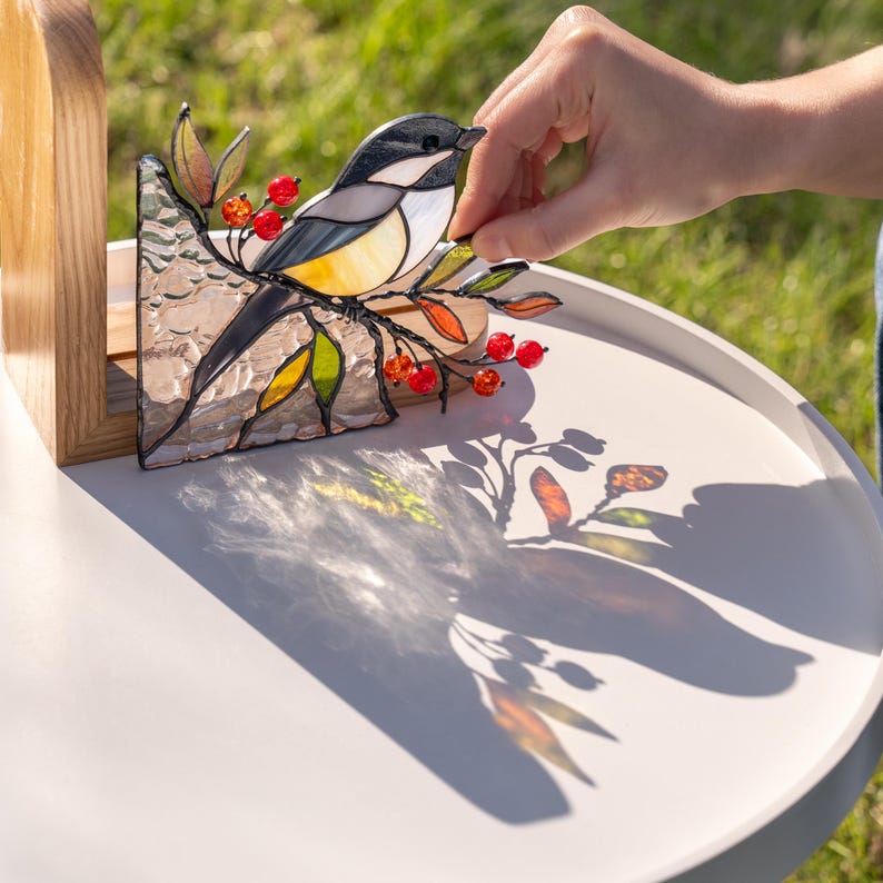 Book shelf decor with chickadee and handmade stained glass design.
