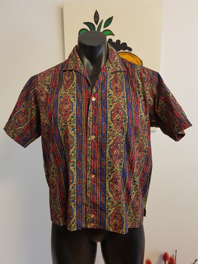 Very cool 1960s casual cotton shirt in olive green rasberry and bright blue paisley .