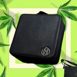 May include: Black leather carrying case with a gold hexagonal logo that says "HUSH". The case has a zipper closure and a shoulder strap.