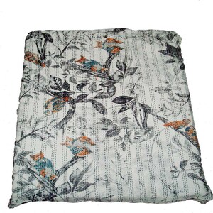 May include: A white kantha quilt with a black and gray floral pattern and orange and blue birds. The quilt has a striped pattern.