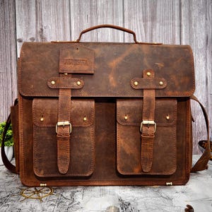 distressed brown full-grain leather messenger bag with double front buckle pockets