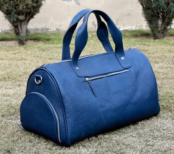 blue leather duffle bag